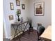 Nicely appointed entryway with a console table, decorative items, and various framed images on the wall at 15 Perthshire Dr, Peachtree City, GA 30269
