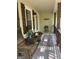 Inviting front porch featuring wooden rocking chairs and decor providing a cozy entry at 15 Perthshire Dr, Peachtree City, GA 30269