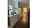 Hallway with full length mirrored closet, window, and hardwood floors at 15 Perthshire Dr, Peachtree City, GA 30269