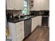 Kitchen features a stainless steel dishwasher and granite countertops at 15 Perthshire Dr, Peachtree City, GA 30269