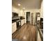 Spacious kitchen features stainless steel appliances, white cabinetry, and granite countertops at 15 Perthshire Dr, Peachtree City, GA 30269