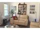 Cozy living room featuring hardwood floors, natural light, and a comfortable couch at 15 Perthshire Dr, Peachtree City, GA 30269