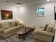 Cozy living room with comfortable sofas, a unique wood coffee table, and a relaxing atmosphere at 15 Perthshire Dr, Peachtree City, GA 30269