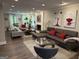 Spacious living room featuring modern sofas, a fireplace, and stylish decor at 15 Perthshire Dr, Peachtree City, GA 30269