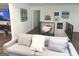 Cozy living room area with soft gray sofa and decorative artwork on the walls at 15 Perthshire Dr, Peachtree City, GA 30269