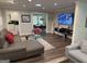 Inviting living room with hardwood floors, comfortable seating, and a modern entertainment center at 15 Perthshire Dr, Peachtree City, GA 30269