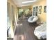 Light-filled sunroom with comfortable seating, skylights, and views of the outdoors at 15 Perthshire Dr, Peachtree City, GA 30269