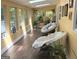 Sunny sunroom with abundant natural light, plants, and multiple windows at 15 Perthshire Dr, Peachtree City, GA 30269