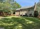 Beautiful backyard view with patio seating and lush greenery at 3999 Cumberland Se Trl, Conyers, GA 30094