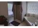 Bathroom featuring a corner bathtub with jacuzzi jets and a glass shower at 3999 Cumberland Se Trl, Conyers, GA 30094