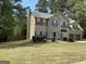 Charming home with brick and siding exterior, and a well-manicured lawn at 3999 Cumberland Se Trl, Conyers, GA 30094
