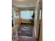 Hallway nook with hardwood floors, oriental rug, and shelving unit at 3999 Cumberland Se Trl, Conyers, GA 30094