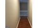 Hallway with hardwood floors and white trim at 3999 Cumberland Se Trl, Conyers, GA 30094