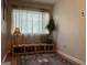 Hallway nook with hardwood floors, oriental rug, and shelving unit at 3999 Cumberland Se Trl, Conyers, GA 30094