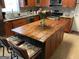 Kitchen featuring a central island with a wood countertop, stainless appliances, and flowers at 3999 Cumberland Se Trl, Conyers, GA 30094