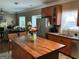 Open kitchen featuring an island, stainless steel appliances, and wood cabinetry at 3999 Cumberland Se Trl, Conyers, GA 30094