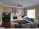 Comfortable living room with a cozy fireplace, sectional sofa, decorative rug and bright decor at 3999 Cumberland Se Trl, Conyers, GA 30094