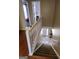 Staircase with carpeted steps and white railings leading to the main floor at 3999 Cumberland Se Trl, Conyers, GA 30094