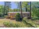 This property features a backyard with a wooden deck, privacy fence, and a shed at 842 Brighton Dr, Lawrenceville, GA 30043