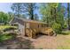 A home's backyard featuring a wood deck and a fenced-in lawn space at 842 Brighton Dr, Lawrenceville, GA 30043