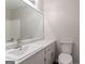 This bathroom features a modern vanity and a shower with white tiling at 842 Brighton Dr, Lawrenceville, GA 30043