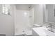 A bathroom featuring a shower with white tiling, toilet, and modern vanity at 842 Brighton Dr, Lawrenceville, GA 30043