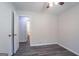 This is a well-lit bedroom with wood floors and a ceiling fan at 842 Brighton Dr, Lawrenceville, GA 30043