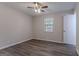Bedroom with wood floors, a ceiling fan, and a window to let in natural light at 842 Brighton Dr, Lawrenceville, GA 30043