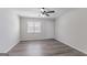 Open-concept living room featuring modern light fixtures, wood-look floors and a window providing natural light at 842 Brighton Dr, Lawrenceville, GA 30043
