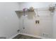This utility room features wood-look flooring, utility connections, and an outlet at 842 Brighton Dr, Lawrenceville, GA 30043
