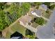 Aerial view of the house with a well-maintained lawn and a circular driveway at 1275 Mill Shyre Way, Lawrenceville, GA 30043