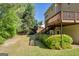Expansive backyard featuring a wooden deck, mature trees, and lush green lawn at 1275 Mill Shyre Way, Lawrenceville, GA 30043