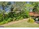 Secluded backyard featuring deck with mature trees at 1275 Mill Shyre Way, Lawrenceville, GA 30043