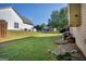 Spacious backyard with well-maintained lawn, bordered by trees and adjacent homes at 1275 Mill Shyre Way, Lawrenceville, GA 30043