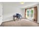 Bedroom featuring a sunny window, a desk and neutral-toned walls at 1275 Mill Shyre Way, Lawrenceville, GA 30043