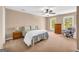Bedroom featuring a bed, dresser, bedside tables and lots of natural light from a large window at 1275 Mill Shyre Way, Lawrenceville, GA 30043
