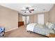 Spacious bedroom featuring neutral walls, ceiling fan, and adjacent closet space at 1275 Mill Shyre Way, Lawrenceville, GA 30043