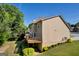 Exterior of home showing deck, stairs, landscaping and neutral siding at 1275 Mill Shyre Way, Lawrenceville, GA 30043