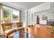 Bright living room with hardwood floors, large windows, and comfortable seating at 1275 Mill Shyre Way, Lawrenceville, GA 30043