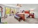 Spacious main bedroom with a king size bed, large windows, and plenty of natural light at 1275 Mill Shyre Way, Lawrenceville, GA 30043