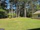 Spacious backyard with mature trees offering both shade and privacy at 140 Julie Rd, Tyrone, GA 30290