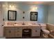 Stylish bathroom with double vanity, tile flooring, and separate commode at 140 Julie Rd, Tyrone, GA 30290