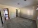 Bedroom with grey carpet and an open doorway with view into another room at 140 Julie Rd, Tyrone, GA 30290