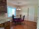 Breakfast nook with hardwood floors and stylish chairs ideal for casual dining with lots of sunshine at 140 Julie Rd, Tyrone, GA 30290
