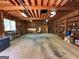Spacious detached garage interior with visible beams and shelving, ideal for storage at 140 Julie Rd, Tyrone, GA 30290