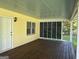 A covered porch with ample space offers an inviting outdoor area, connecting seamlessly to the home's interior at 140 Julie Rd, Tyrone, GA 30290
