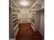 Walk-in closet with shelving, hardwood floors and recessed lights at 140 Julie Rd, Tyrone, GA 30290