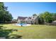 A spacious backyard with a large in-ground pool and plenty of room for outdoor activities, perfect for Gathering gatherings at 207 Jamestown Ave, Jonesboro, GA 30236