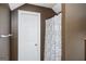 Stylish bathroom with shower/tub combination with tiled shower with a decorative curtain at 207 Jamestown Ave, Jonesboro, GA 30236