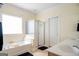 Bright bathroom features a soaking tub and a walk-in shower at 207 Jamestown Ave, Jonesboro, GA 30236